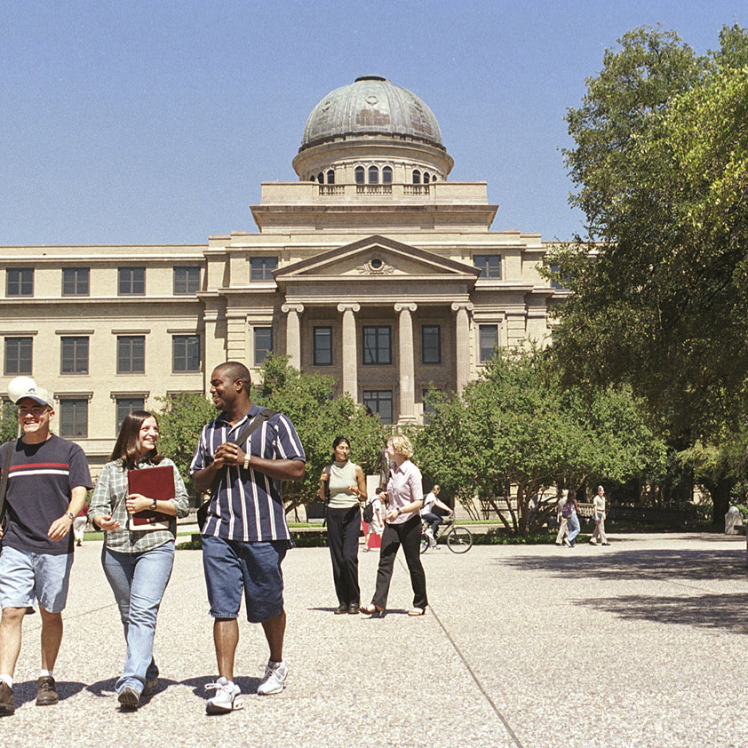 Students walking in front of the university